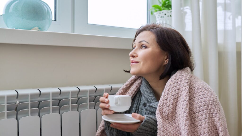 Women with blanket relaxing drinking a tea