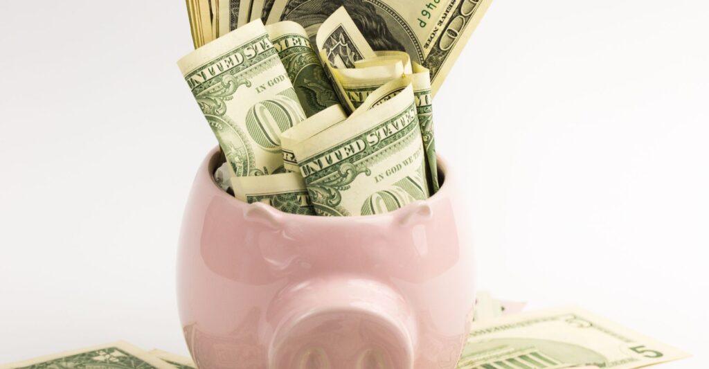 A bunch of cash in a piggy bank