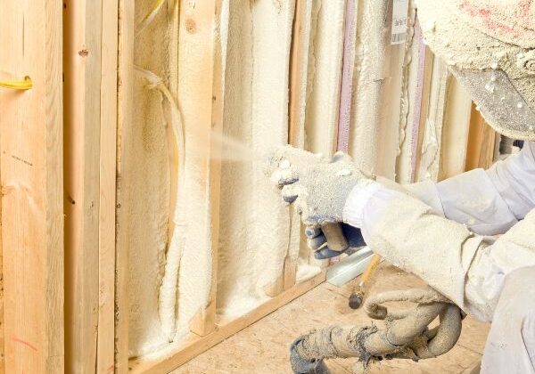 Spray foam being installed onto a wall