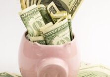 A bunch of cash in a piggy bank